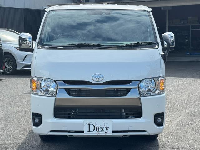 ハイエースバン ロングスーパーGL ダークプライムS 純正アルミホール パノラミックビューモニターカメラ デジタルインナーミラー フロントドアスカフプレート LEDヘッド 両側電動パワースライド アクセサリーコンセント フェンダーミラー 特別仕様車(9枚目)