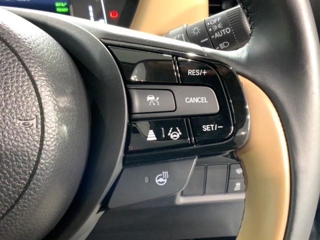 フィット ｅ：ＨＥＶリュクス　Ｈ　ＳＥＮＳＩＮＧ　新車保証　試乗車　ワンオ－ナ－　純正ナビ　ＴＶ　Ｒカメラ　マルチビュ－　ＢＴオ－ディオ　ＥＴＣ　ＬＥＤライト　ＶＳＡ　シ－トヒ－タ－　クルコン　アルミ　スマ－トキ－　盗難防止装置（11枚目）