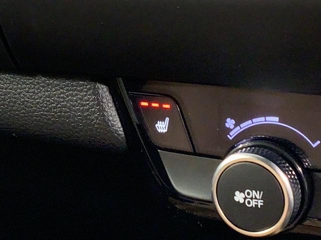 フィット ｅ：ＨＥＶリュクス　Ｈ　ＳＥＮＳＩＮＧ　新車保証　試乗車　ワンオ－ナ－　純正ナビ　ＴＶ　Ｒカメラ　マルチビュ－　ＢＴオ－ディオ　ＥＴＣ　ＬＥＤライト　ＶＳＡ　シ－トヒ－タ－　クルコン　アルミ　スマ－トキ－　盗難防止装置（14枚目）