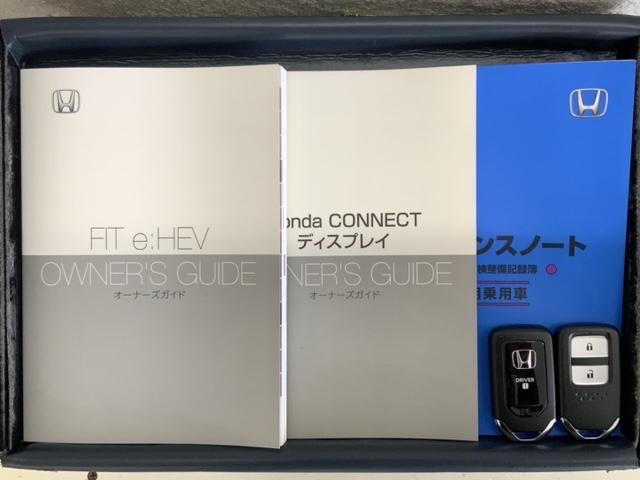 フィット ｅ：ＨＥＶリュクス　Ｈ　ＳＥＮＳＩＮＧ　新車保証　試乗車　ワンオ－ナ－　純正ナビ　ＴＶ　Ｒカメラ　マルチビュ－　ＢＴオ－ディオ　ＥＴＣ　ＬＥＤライト　ＶＳＡ　シ－トヒ－タ－　クルコン　アルミ　スマ－トキ－　盗難防止装置（16枚目）
