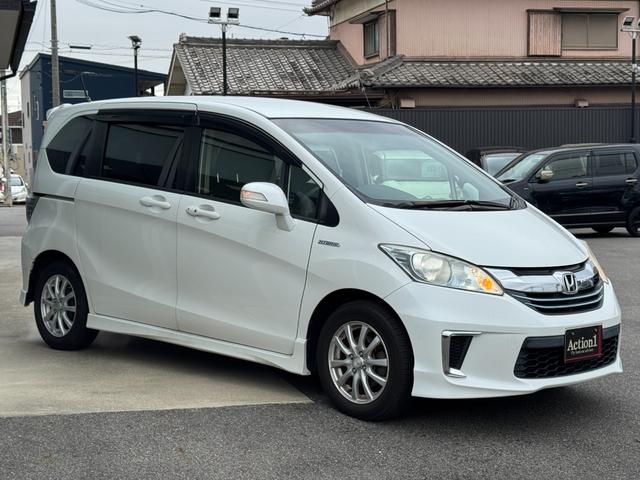 フリードハイブリッド ジャストセレクション　ナビ　ＴＶ　ＥＴＣ　バックカメラ　両側パワースライドドア　ＨＩＤヘッドライト　ＣＤ／ＤＶＤ再生　オートエアコン　オートライト　スマートキー　社外１５インチアルミホイール（13枚目）