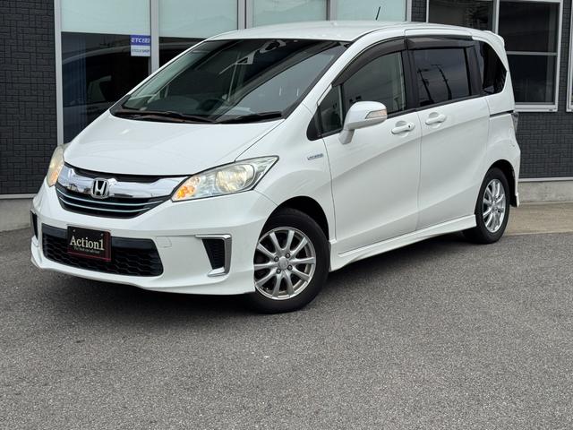 フリードハイブリッド ジャストセレクション　ナビ　ＴＶ　ＥＴＣ　バックカメラ　両側パワースライドドア　ＨＩＤヘッドライト　ＣＤ／ＤＶＤ再生　オートエアコン　オートライト　スマートキー　社外１５インチアルミホイール（14枚目）