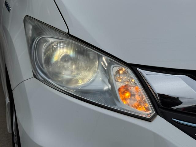 フリードハイブリッド ジャストセレクション　ナビ　ＴＶ　ＥＴＣ　バックカメラ　両側パワースライドドア　ＨＩＤヘッドライト　ＣＤ／ＤＶＤ再生　オートエアコン　オートライト　スマートキー　社外１５インチアルミホイール（16枚目）