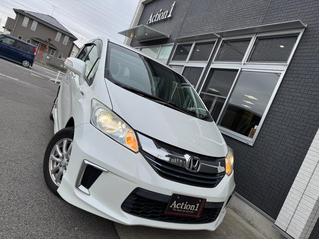 フリードハイブリッド ジャストセレクション　ナビ　ＴＶ　ＥＴＣ　バックカメラ　両側パワースライドドア　ＨＩＤヘッドライト　ＣＤ／ＤＶＤ再生　オートエアコン　オートライト　スマートキー　社外１５インチアルミホイール（17枚目）