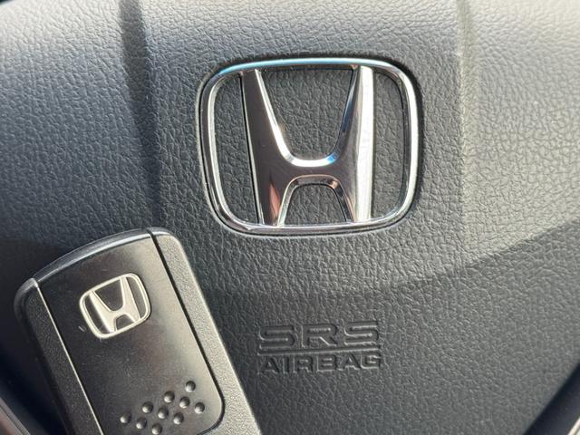 フリードハイブリッド ジャストセレクション　ナビ　ＴＶ　ＥＴＣ　バックカメラ　両側パワースライドドア　ＨＩＤヘッドライト　ＣＤ／ＤＶＤ再生　オートエアコン　オートライト　スマートキー　社外１５インチアルミホイール（28枚目）