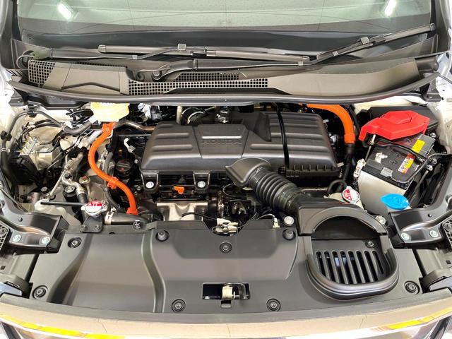 ステップワゴン ｅ：ＨＥＶスパーダ　登録済み未使用車　純正１１．４インチナビ　両側電動スライドドア　アダプティブクルーズコントロール　ブラインドスポットモニター　ＬＥＤヘッドライト　ハーフレザーシート　シートヒーター　フルセグ（18枚目）