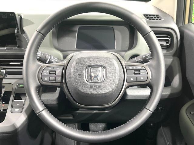 フリード e:HEVクロスター 登録済未使用車 両側電動ドア ホンダセンシング アダプティブクルーズ スマートキー 衝突被害軽減システム ハーフレザーシート コーナーセンサー LEDヘッド 車線逸脱警報 オートライト LEDフォグ(12枚目)