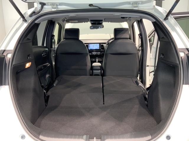 フィット ホーム H SENSING 新車保証 試乗車 ワンオーナー ナビVXU-245FTi TV Rカメラ CD録音 BTオ-ディオ DVD ETC LEDライト VSA クルコン スマートキー 盗難防止装置(19枚目)