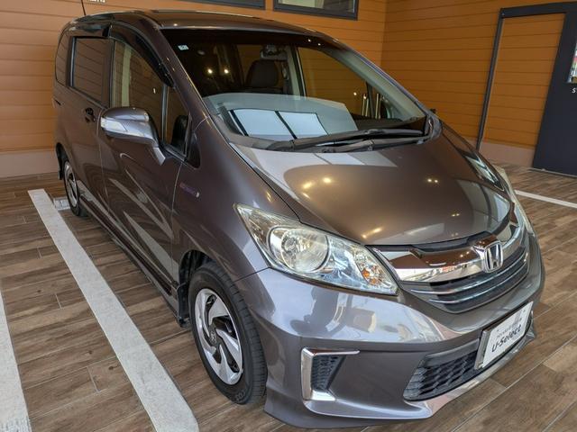 フリードハイブリッド ハイブリッド 1年間走行無制限保証 助手席リフトアップシート仕様 片側電動スライドドア純正NAVI ワンセグ バックカメラ ディスチャージヘッドライトワンオーナー 禁煙車(7枚目)