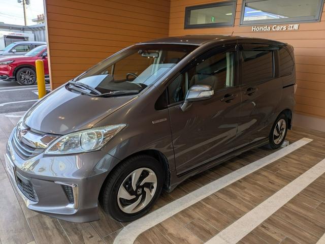 フリードハイブリッド ハイブリッド 1年間走行無制限保証 助手席リフトアップシート仕様 片側電動スライドドア純正NAVI ワンセグ バックカメラ ディスチャージヘッドライトワンオーナー 禁煙車(9枚目)