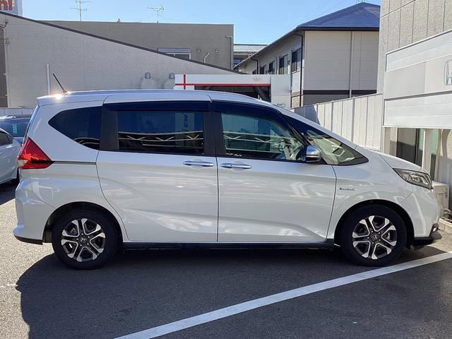 フリード+ハイブリッド ハイブリッド・クロスターホンダセンシング 当店下取 ワンオーナー タイヤ4本新品 純正ギャザズ9インチインターナビ リアカメラ 純正ギャザ11.6インチリア席モニター シートヒーター クルーズコントロール VSA 純正ETC ルーフレール(27枚目)