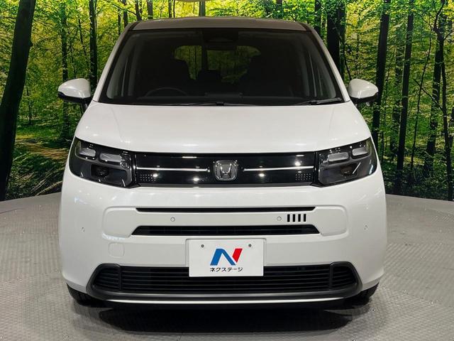 フリード エアー EX 7人 純正9型ナビ 両側電動ドア 禁煙車 バックカメラ ETC リアクーラー ブラインドスポットモニター シートヒーター 純正15インチアルミ ホンダセンシング レーダークルーズ LEDヘッドライト(14枚目)