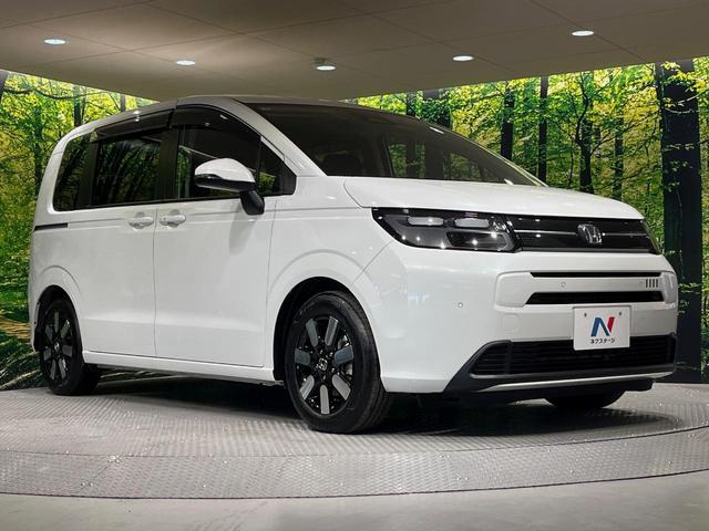 フリード エアー EX 7人 純正9型ナビ 両側電動ドア 禁煙車 バックカメラ ETC リアクーラー ブラインドスポットモニター シートヒーター 純正15インチアルミ ホンダセンシング レーダークルーズ LEDヘッドライト(16枚目)