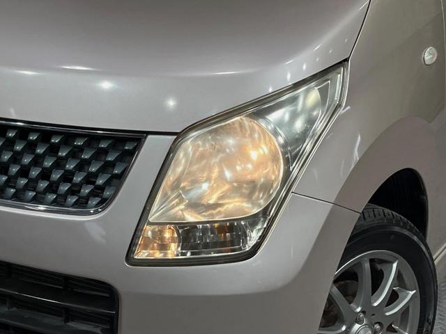 ワゴンＲ ＦＸリミテッド　純正ＣＤオーディオナビ　禁煙車　スマートキー　ヘッドライトレベライザー　ドアバイザー　１４インチアルミホイール　電動格納ドアミラー（11枚目）