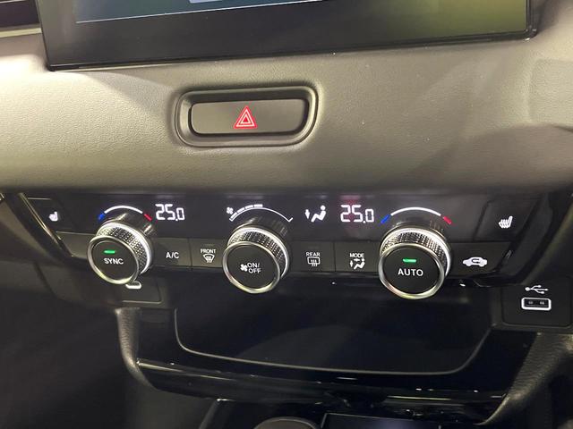 ヴェゼル ｅ：ＨＥＶ　Ｚ　全周囲カメラ　プレミアムオーディオ　メーカーナビ　ＥＴＣ２．０　ワイヤレス充電　登録済未使用車　電動リアゲート　シートヒーター　シーケンシャルウィンカー　ブラインドスポットモニター　後退出庫サポート（34枚目）