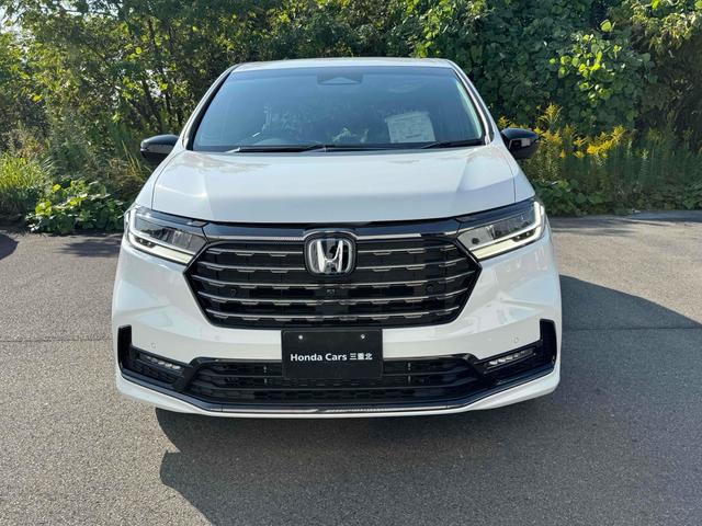 オデッセイハイブリッド ｅ：ＨＥＶアブソルート・ＥＸブラックエディション　ハイブリッド　両側電動スライドドア　クリアランスソナー　オートクルーズコントロール　レーンアシスト　衝突被害軽減システム　ＬＥＤヘッドランプ　電動リアゲート　スマートキー　ＣＶＴ　盗難防止システム（2枚目）