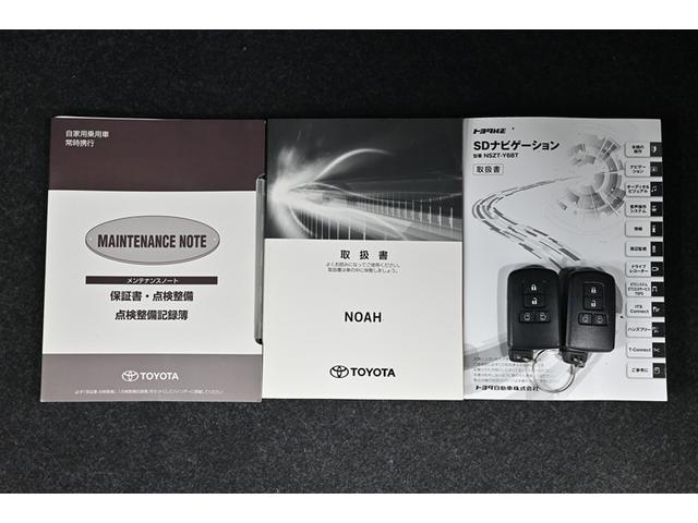 ノア Ｓｉ　ダブルバイビーＩＩ　横滑防止装置　ＰＣＳ　スマートキ－　Ｗエアコン　Ｂモニター　ＤＶＤ再生可　フルセグテレビ　ＥＴＣ付き　オートエアコン　ＰＳ　ナビ＆ＴＶ　ＰＷ　ＬＥＤヘッド　盗難防止システム　ＡＢＳ　３列シート（17枚目）
