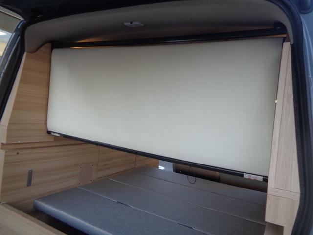 キャラバン グランドプレミアムＧＸ　マイルーム　ワンオーナー　４ＷＤ　スペアスマートキー有　パワースライドドア　折りたたみベッド　ＯＨＬＩＮＳショックアブソーバー　社外ボンネットスポイラー　社外リアスポイラー　外部給電（5枚目）