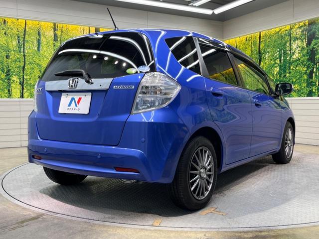 ハイブリッド・10thアニバーサリー 禁煙車 純正SDナビ バックカメラ ETC クルーズコントロール スマートキー 革巻きステアリング DVD再生 盗難防止装置 プライバシーガラス ベンチシート バニティミラー(18枚目)