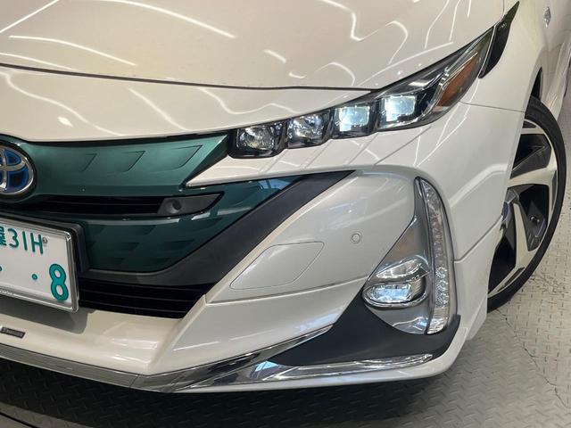 プリウスＰＨＶ Ａプレミアム　禁煙車　モデリスタ　１１．６型ナビ　衝突軽減　レーダークルーズ　ＢＳＭ　ＨＵＤ　パーキングアシスト　合皮レザー　パワーシート　シートヒーター　クリアランスソナー　モデリスタ１８インチＡＷ　ＡＣ１００Ｖ（12枚目）