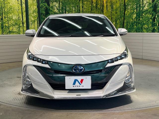 プリウスＰＨＶ Ａプレミアム　禁煙車　モデリスタ　１１．６型ナビ　衝突軽減　レーダークルーズ　ＢＳＭ　ＨＵＤ　パーキングアシスト　合皮レザー　パワーシート　シートヒーター　クリアランスソナー　モデリスタ１８インチＡＷ　ＡＣ１００Ｖ（14枚目）