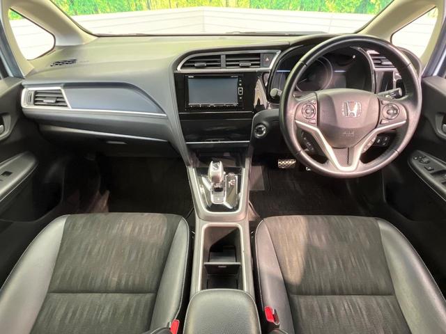 シャトル ハイブリッドX ホンダセンシング 純正ナビ バックカメラ ホンダセンシング レーダークルーズ 禁煙車 ハーフレザーシート シートヒーター スマートキー LEDヘッド ETC 車線逸脱警報 誤発進抑制機能 先行車発進お知らせ機能(2枚目)