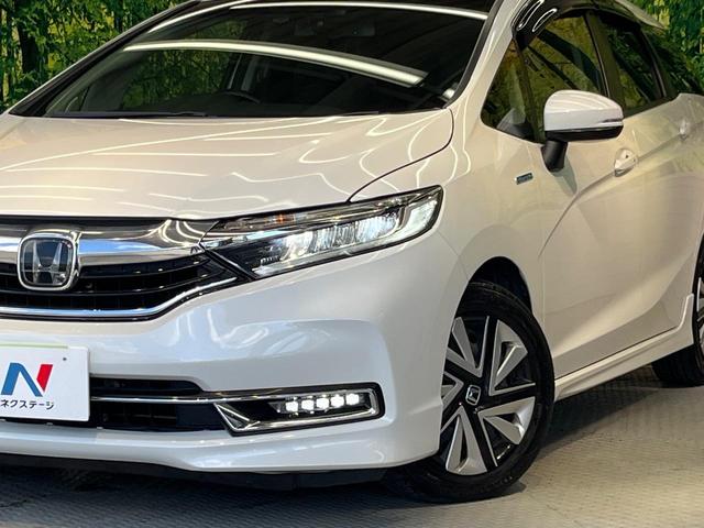 シャトル ハイブリッドX ホンダセンシング 純正ナビ バックカメラ ホンダセンシング レーダークルーズ 禁煙車 ハーフレザーシート シートヒーター スマートキー LEDヘッド ETC 車線逸脱警報 誤発進抑制機能 先行車発進お知らせ機能(12枚目)