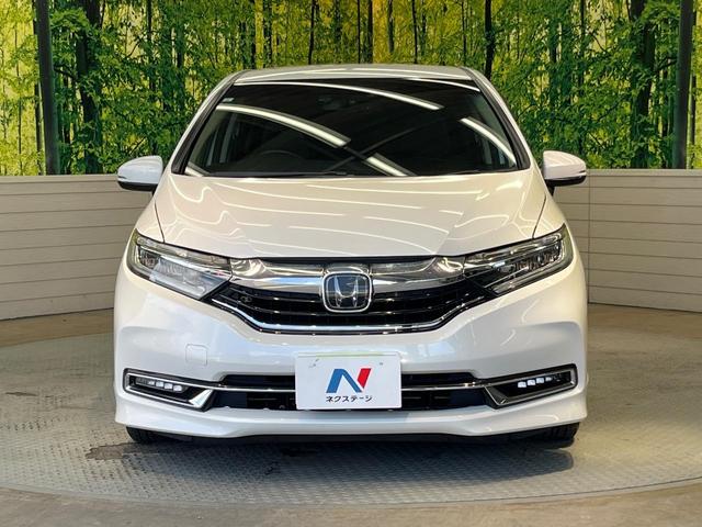 シャトル ハイブリッドX ホンダセンシング 純正ナビ バックカメラ ホンダセンシング レーダークルーズ 禁煙車 ハーフレザーシート シートヒーター スマートキー LEDヘッド ETC 車線逸脱警報 誤発進抑制機能 先行車発進お知らせ機能(14枚目)