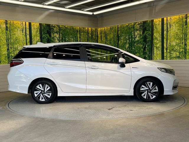 シャトル ハイブリッドX ホンダセンシング 純正ナビ バックカメラ ホンダセンシング レーダークルーズ 禁煙車 ハーフレザーシート シートヒーター スマートキー LEDヘッド ETC 車線逸脱警報 誤発進抑制機能 先行車発進お知らせ機能(27枚目)