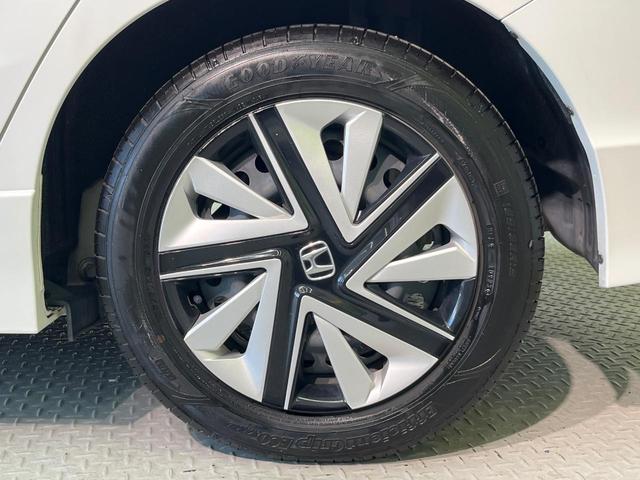 シャトル ハイブリッドX ホンダセンシング 純正ナビ バックカメラ ホンダセンシング レーダークルーズ 禁煙車 ハーフレザーシート シートヒーター スマートキー LEDヘッド ETC 車線逸脱警報 誤発進抑制機能 先行車発進お知らせ機能(28枚目)