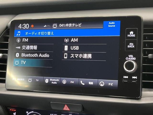 フィット ｅ：ＨＥＶリュクス　純正９型ナビ　全周囲カメラ　衝突被害軽減システム　レーダークルーズ　禁煙車　ハーフレザーシート　コーナーセンサー　スマートキー　ＬＥＤヘッド　ビルトインＥＴＣ　純正１６インチアルミ　オートハイビーム（35枚目）