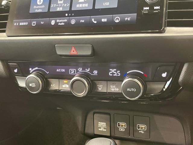 フィット ｅ：ＨＥＶリュクス　純正９型ナビ　全周囲カメラ　衝突被害軽減システム　レーダークルーズ　禁煙車　ハーフレザーシート　コーナーセンサー　スマートキー　ＬＥＤヘッド　ビルトインＥＴＣ　純正１６インチアルミ　オートハイビーム（62枚目）