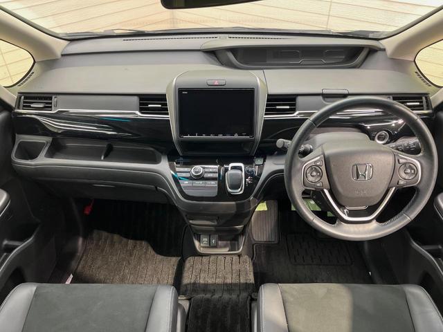 フリードハイブリッド ハイブリッド・モデューロＸ　ホンダセンシング　９型ナビ　両側電動ドア　バックカメラ　衝突被害軽減システム　レーダークルーズ　禁煙車　ハーフレザーシート　スマートキー　ＬＥＤヘッド　ＥＴＣ　純正１５インチアルミ　車線逸脱警報　オートライト（2枚目）