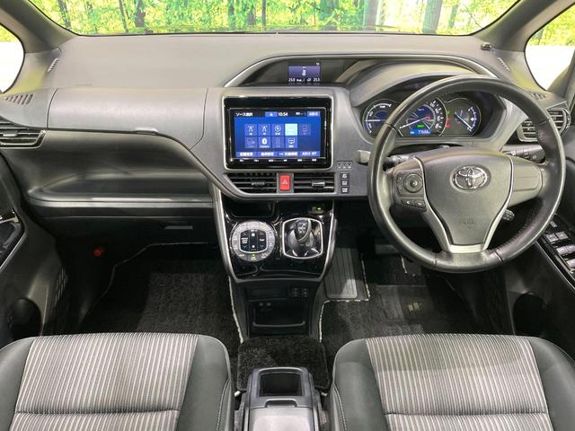 ヴォクシー ハイブリッドＺＳ　煌　純正９型ＳＤナビ　後席モニター　両側電動ドア　バックカメラ　衝突被害軽減システム　禁煙車　ドラレコ　スマートキー　ＬＥＤヘッド　ビルトインＥＴＣ　クルコン　純正１６ＡＷ　オートライト　デュアルエアコン（2枚目）