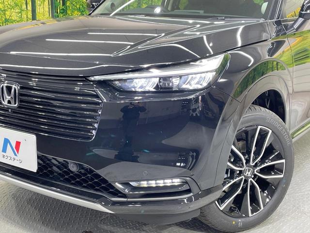 ヴェゼル ｅ：ＨＥＶ　Ｚ　登録済未使用車　純正９型ナビ　全周囲カメラ　衝突軽減装置　　電動リアゲート　ブラインドスポットモニター　コーナーセンサー　スマートキー　ＬＥＤヘッド　ＥＴＣ　純正１８インチアルミ　オートライト（12枚目）