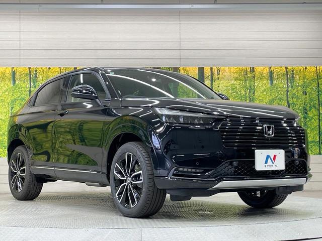 ヴェゼル ｅ：ＨＥＶ　Ｚ　登録済未使用車　純正９型ナビ　全周囲カメラ　衝突軽減装置　　電動リアゲート　ブラインドスポットモニター　コーナーセンサー　スマートキー　ＬＥＤヘッド　ＥＴＣ　純正１８インチアルミ　オートライト（57枚目）