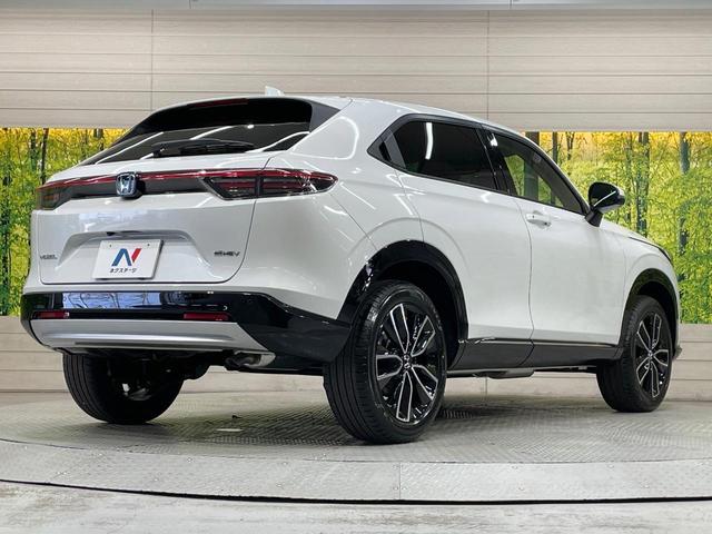 ヴェゼル ｅ：ＨＥＶ　Ｚ　登録済未使用車　純正９型ナビ　全周囲カメラ　衝突軽減装置　ＬＥＤヘッドライト　レーダークルーズ　電動リアゲート　ＥＴＣ　Ｂｌｕｅｔｏｏｔｈ　ブラインドスポットモニター　置くだけ充電　オートエアコン（56枚目）