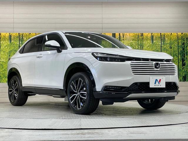 ヴェゼル ｅ：ＨＥＶ　Ｚ　登録済未使用車　純正９型ナビ　全周囲カメラ　衝突軽減装置　ＬＥＤヘッドライト　レーダークルーズ　電動リアゲート　ＥＴＣ　Ｂｌｕｅｔｏｏｔｈ　ブラインドスポットモニター　置くだけ充電　オートエアコン（58枚目）