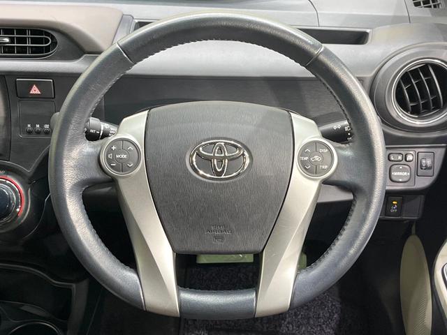 アクア Ｇ　禁煙車　ＣＤオーディオ　スマートキー　オートライト　オートエアコン　革巻きステアリング　電動格納ミラー　シートリフター　ドアザイザー　バニティミラー　パワーステアリング　パワーウィンドウ（11枚目）