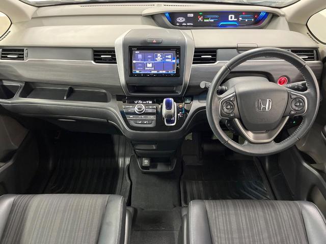 フリードハイブリッド ハイブリッド・ＥＸ　純正ナビ　バックカメラ　両側電動ドア　衝突被害軽減システム　レーダークルーズ　禁煙車　ハーフレザーシート　ドラレコ　スマートキー　ＬＥＤヘッド　ビルトインＥＴＣ　純正１６インチアルミ（2枚目）