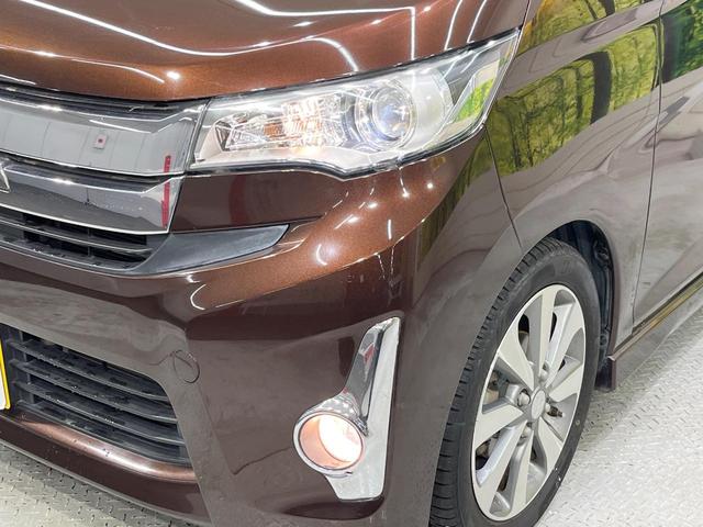 ｅＫカスタム Ｔ　純正ナビ　バックカメラ　禁煙車　スマートキー　ＨＩＤヘッド　純正１５インチアルミ　オートエアコン　ＣＤ　ＤＶＤ再生　フルセグ　電動格納ミラー　盗難防止システム（12枚目）