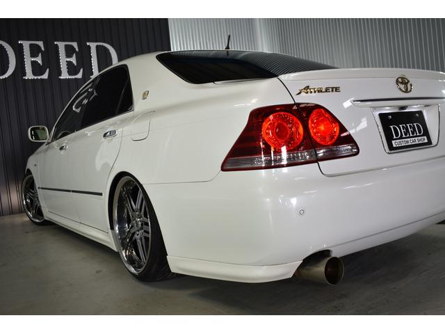 アスリートGパッケージ 黒革シート 車高調 社外19インチメッキホイール ワンオフマフラー メッキグリル メッキピラー フルエアロ トランクスポイラー ゴールドエンブレム シートヒーター 地デジ ETC スモーク施工済(26枚目)
