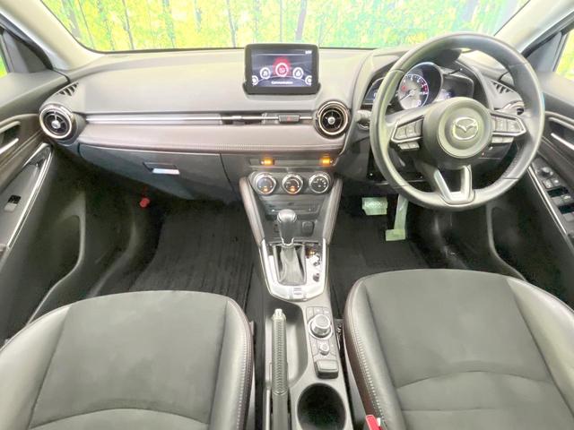 デミオ １３Ｓツーリング　Ｌパッケージ　バックカメラ　衝突被害軽減システム　レーダークルーズ　禁煙車　ハーフレザーシート　ドラレコ　コーナーセンサー　スマートキー　ＬＥＤヘッド　ＥＴＣ　純正１５インチアルミ　車線逸脱警報　オートライト（2枚目）