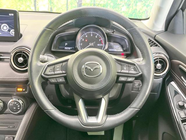 デミオ １３Ｓツーリング　Ｌパッケージ　バックカメラ　衝突被害軽減システム　レーダークルーズ　禁煙車　ハーフレザーシート　ドラレコ　コーナーセンサー　スマートキー　ＬＥＤヘッド　ＥＴＣ　純正１５インチアルミ　車線逸脱警報　オートライト（11枚目）