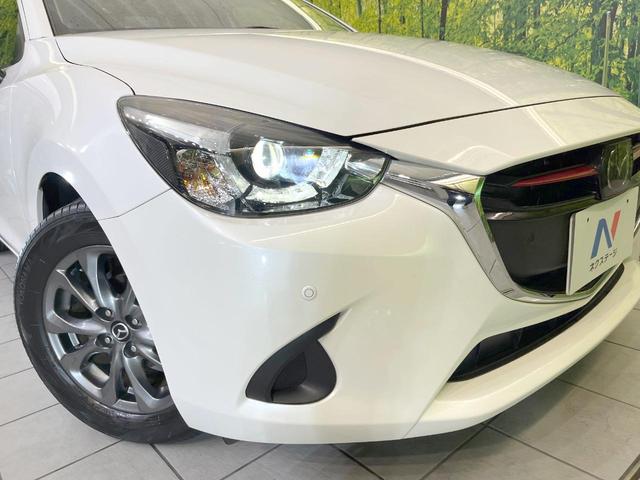 デミオ １３Ｓツーリング　Ｌパッケージ　バックカメラ　衝突被害軽減システム　レーダークルーズ　禁煙車　ハーフレザーシート　ドラレコ　コーナーセンサー　スマートキー　ＬＥＤヘッド　ＥＴＣ　純正１５インチアルミ　車線逸脱警報　オートライト（12枚目）