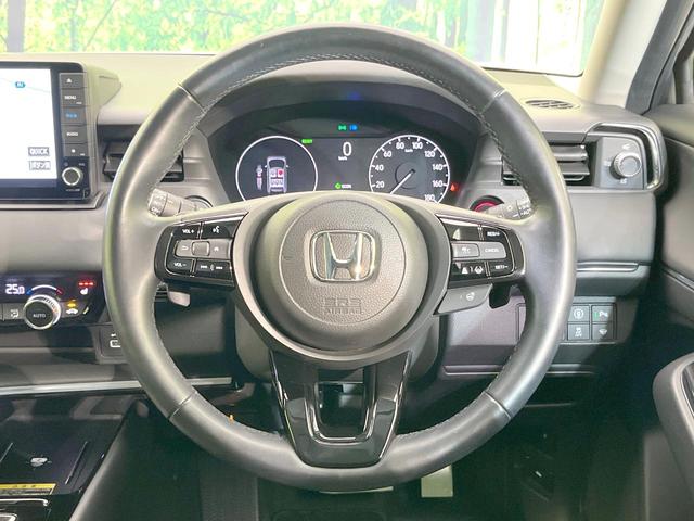 ヴェゼル ｅ：ＨＥＶ　Ｚ　純正９型ナビ　バックカメラ　衝突被害軽減システム　禁煙車　電動リアゲート　ハーフレザーシート　コーナーセンサー　ＬＥＤヘッド　ビルトインＥＴＣ　純正１８インチアルミ　車線逸脱警報　オートライト（11枚目）