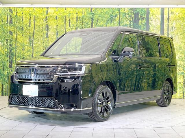 ステップワゴン e:HEVスパーダ 登録済未使用車 両側電動ドア バックカメラ 衝突被害軽減システム 電動リアゲート コーナーセンサー スマートキー LEDヘッド 純正16インチアルミ 車線逸脱警報 オートライト デュアルエアコン(22枚目)