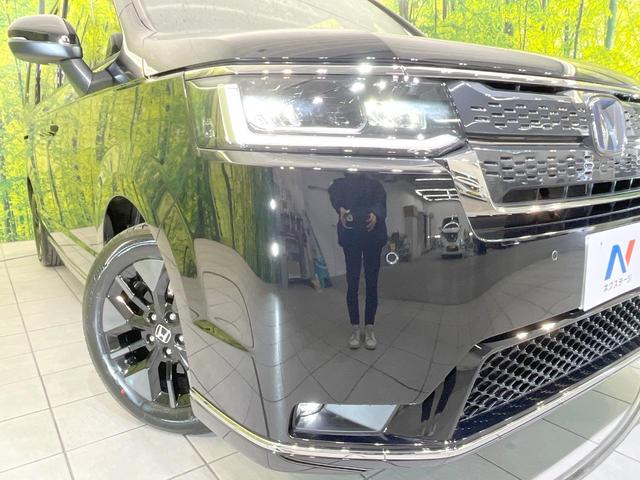 ステップワゴン e:HEVスパーダ 登録済未使用車 両側電動ドア バックカメラ 衝突被害軽減システム 電動リアゲート コーナーセンサー スマートキー LEDヘッド 純正16インチアルミ 車線逸脱警報 オートライト デュアルエアコン(27枚目)