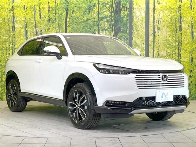 ヴェゼル ｅ：ＨＥＶ　Ｚ　登録済未使用車　全周囲カメラ　衝突被害軽減システム　電動リアゲート　ハーフレザーシート　スマートキー　ＬＥＤヘッド　ビルトインＥＴＣ　純正１８インチアルミ　オートハイビーム　車線逸脱警報（21枚目）