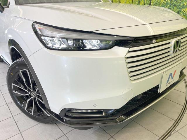 ヴェゼル ｅ：ＨＥＶ　Ｚ　登録済未使用車　全周囲カメラ　衝突被害軽減システム　電動リアゲート　ハーフレザーシート　スマートキー　ＬＥＤヘッド　ビルトインＥＴＣ　純正１８インチアルミ　オートハイビーム　車線逸脱警報（36枚目）